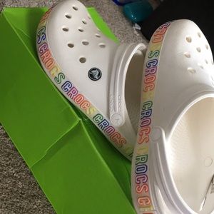 white crocs with rainbow words